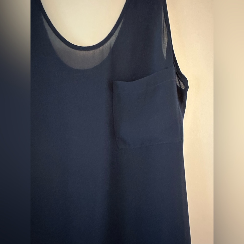Semi sheer tank with beautiful detail in back. Great condition!